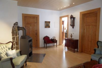 FeWo 'Graf von Berg'<br>Wohnzimmer mit Kamin
